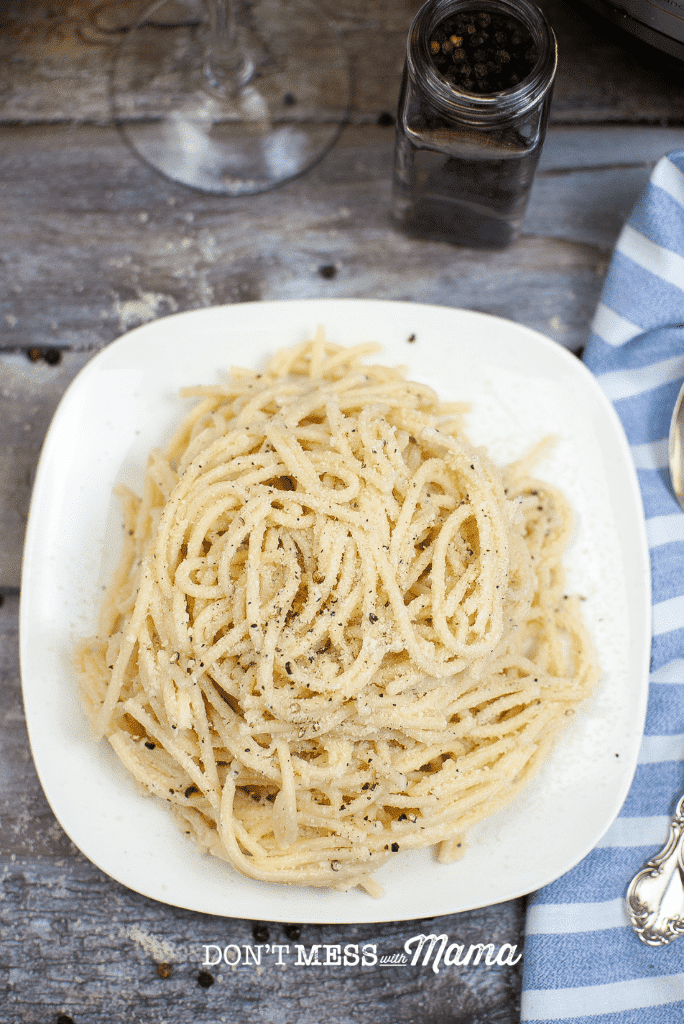 cacio e pepe on a white plate view from above