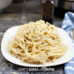 white plate with spaghetti cacio e pepe