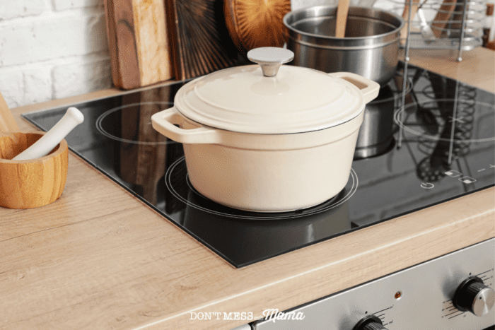 cream colored pot with lid on a stovetop