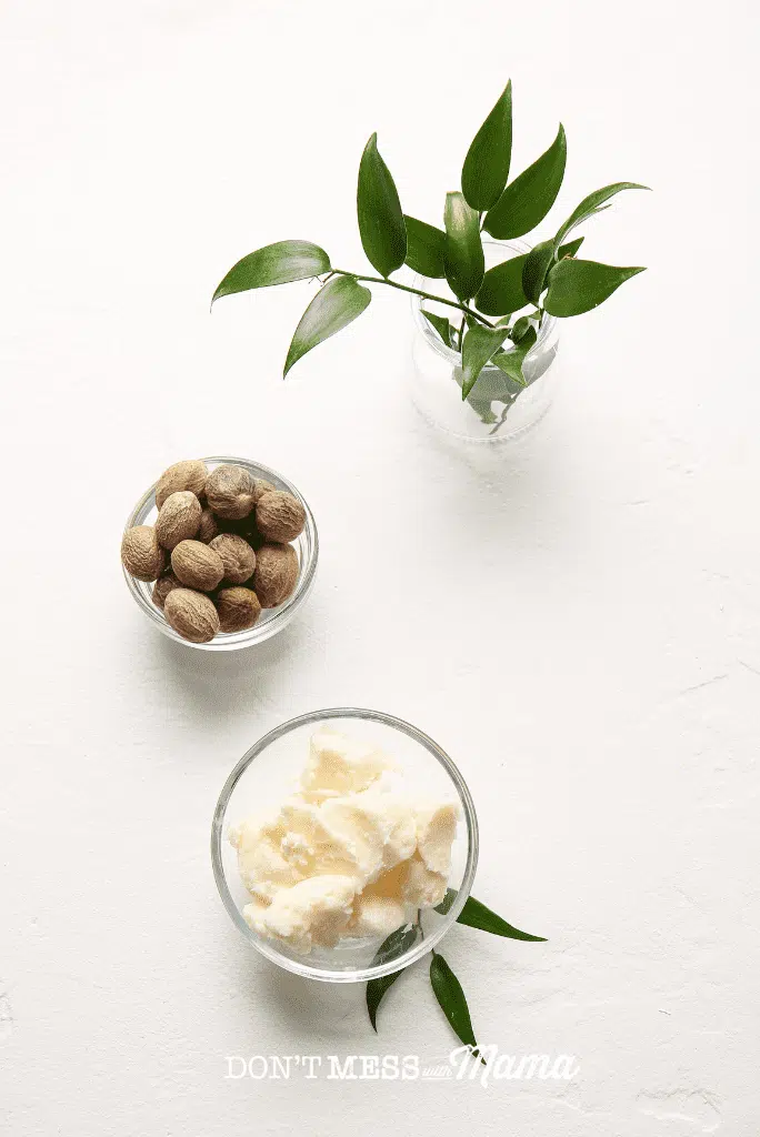 glass bowl with shea butter and small bowl of shea nut