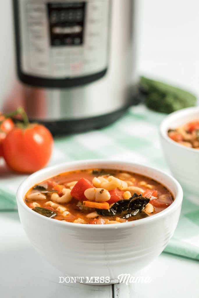 bowl of soup with instant pot in background