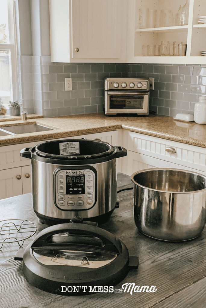 instant pot with accessories on kitchen work surface