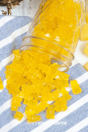 close up of glass jar with yellow pineapple gummy bears