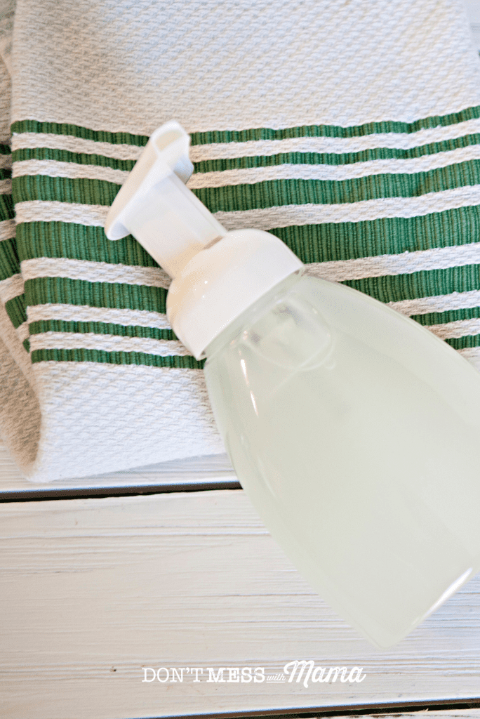 foaming hand wash on green striped towel