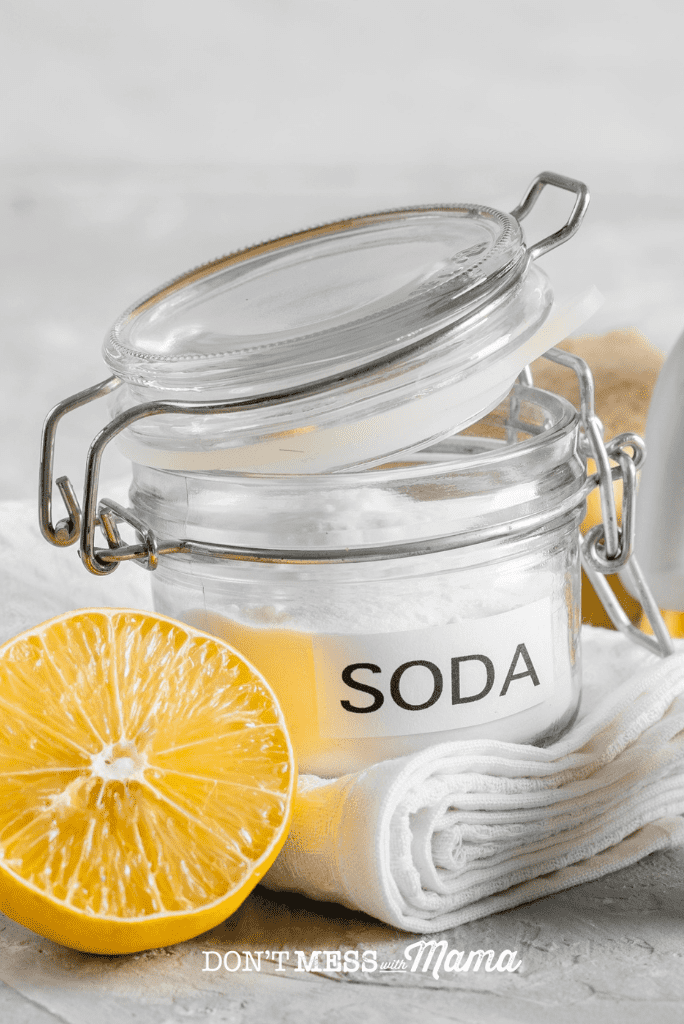 jar of baking soda with lemon slice