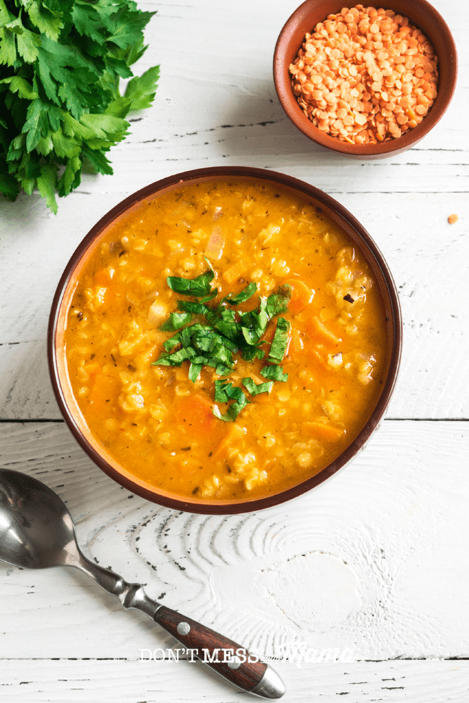 bowl of lentil soup with spoon