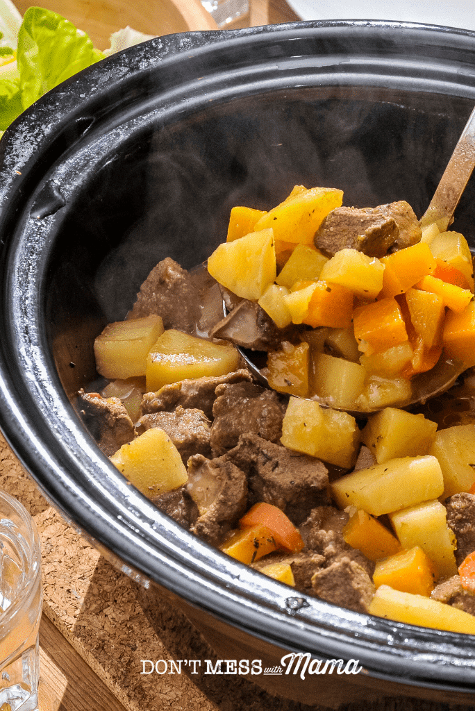 slow cooker with meat and vegetable stew