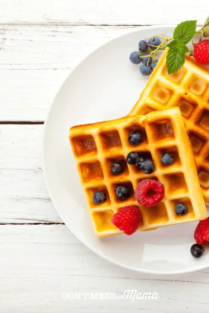 waffles on white place with blueberries and raspberries