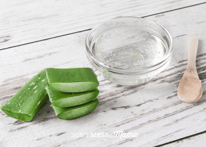 small glass bowl of aloe vera gel with plant pieces