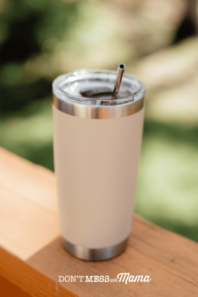 coffee cup with straw outdoors