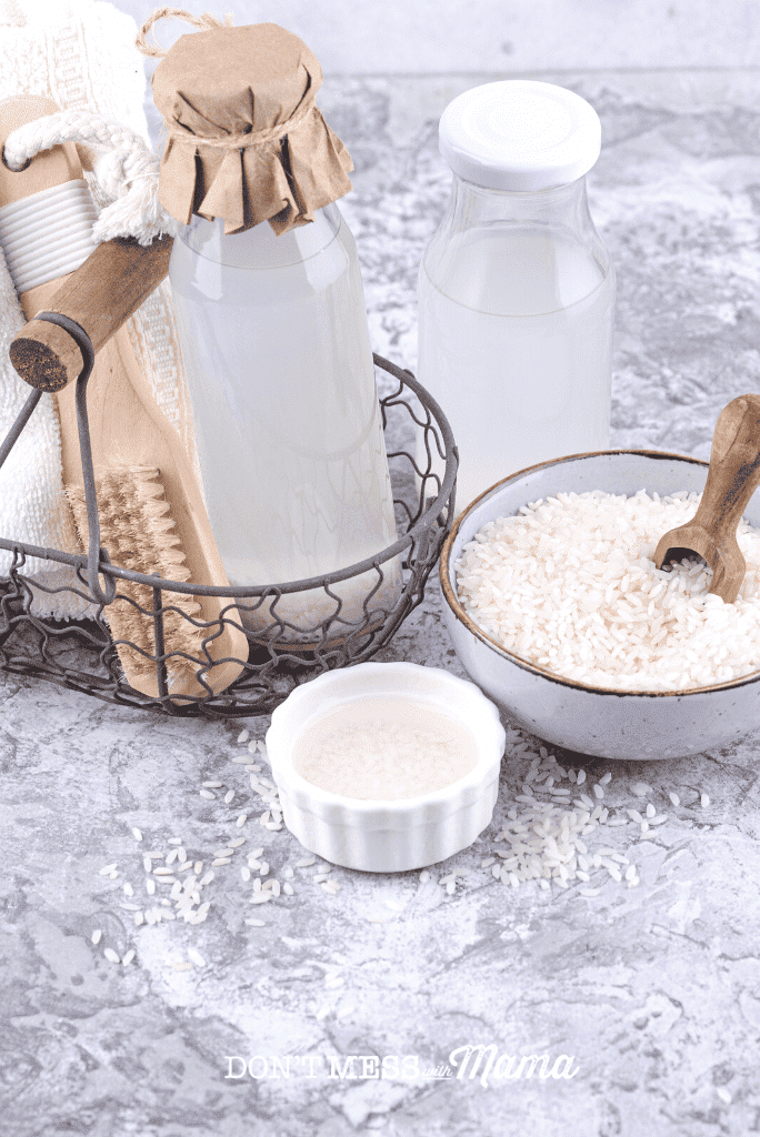 rice water in glass bottle with small bowl of rice