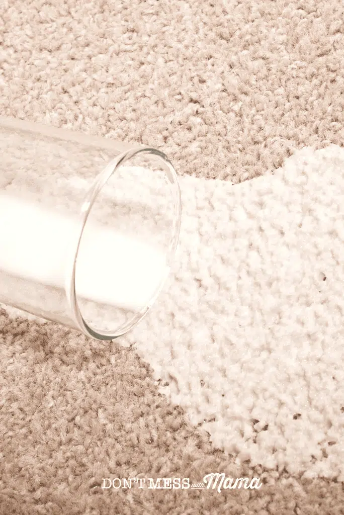 glass of milk spill on carpet