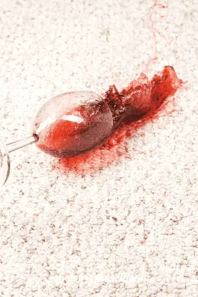 glass of red wine spill on carpet