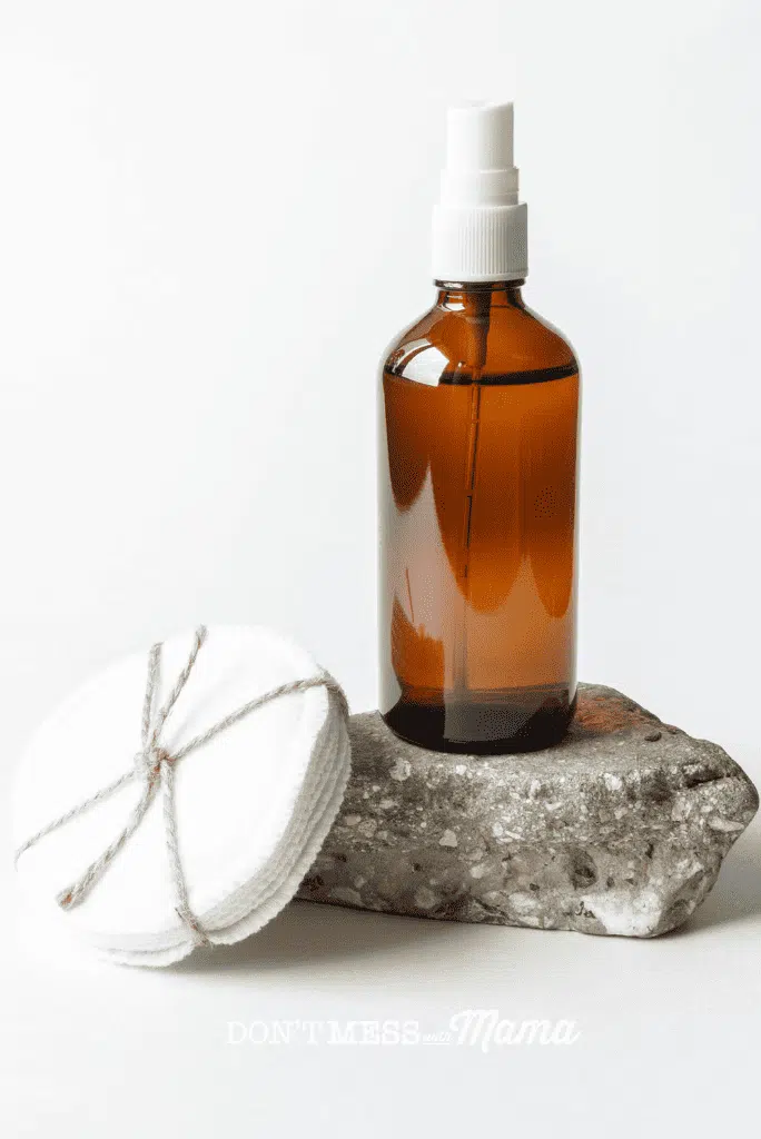 amber glass bottle with salt spray for acne and cotton rounds 