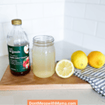 apple cider vinegar and lemon juice drink on a kitchen counter