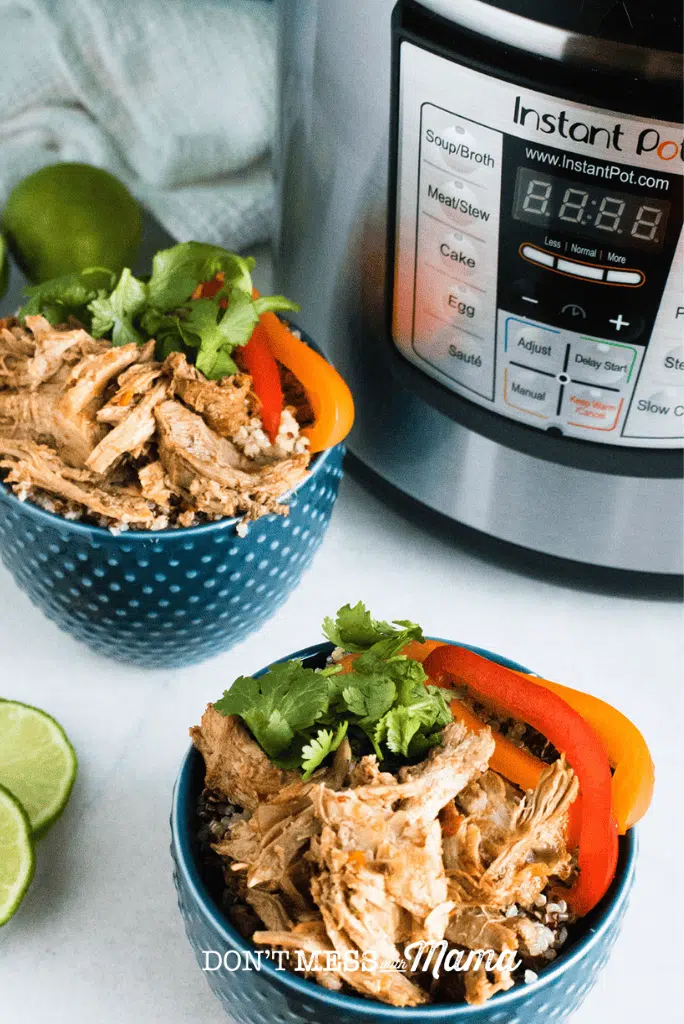 blue bowls of instant pot carnitas with instant pot in background